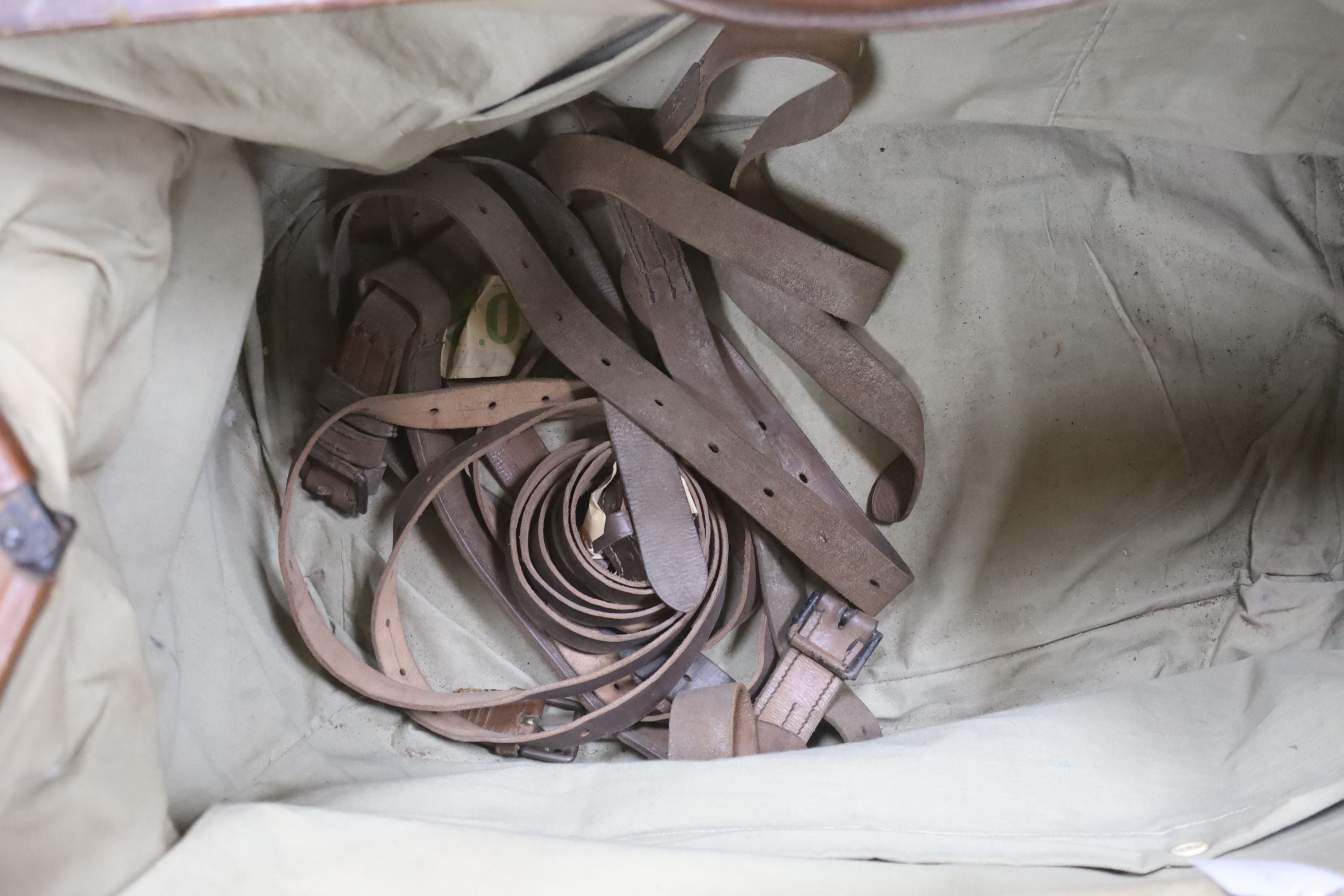 A large Gladstone bag, military canvas contents